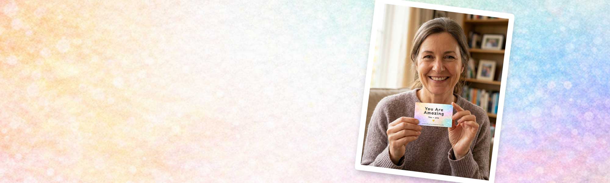 Woman holding an you are amazing card with text against a blurred indoor background