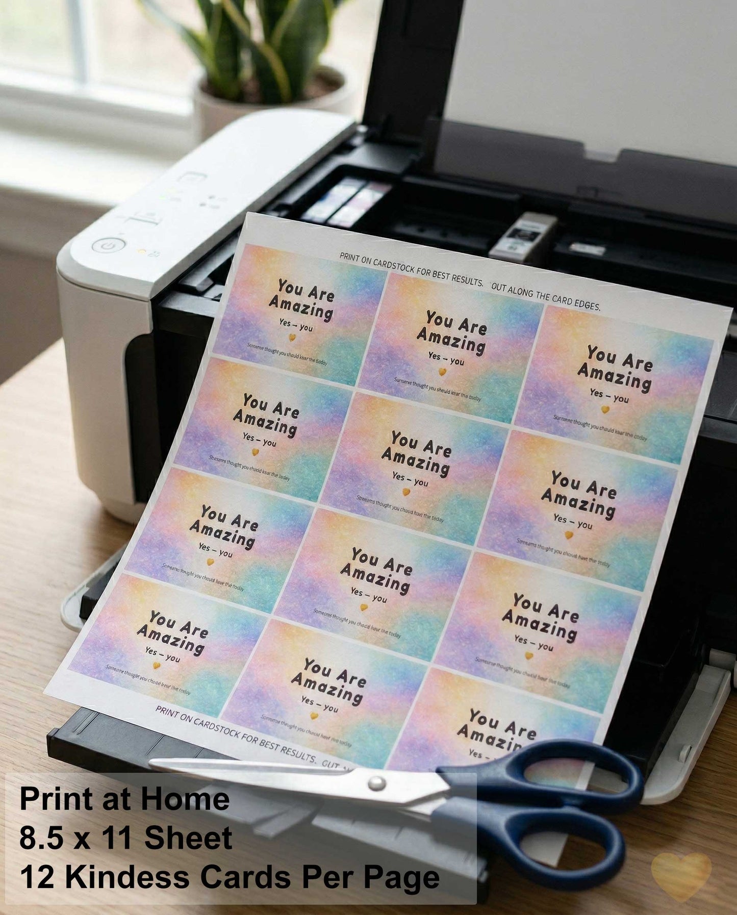 Sheet of 'You Are Amazing' cards being printed on a home printer with scissors nearby.