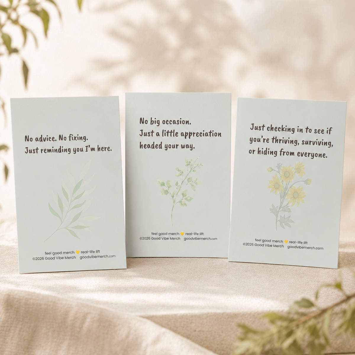 Three greeting cards with motivational messages on a neutral background